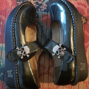 Alegria Dark Green Glossy Mary Jane’s with Skull Accent